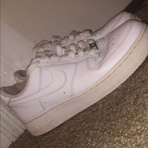 Nike White Sneakers with Classic Athletic Design and Large Swoosh Logo